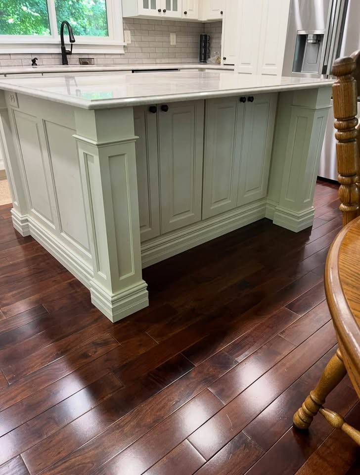 A painted sage island with paneled sides